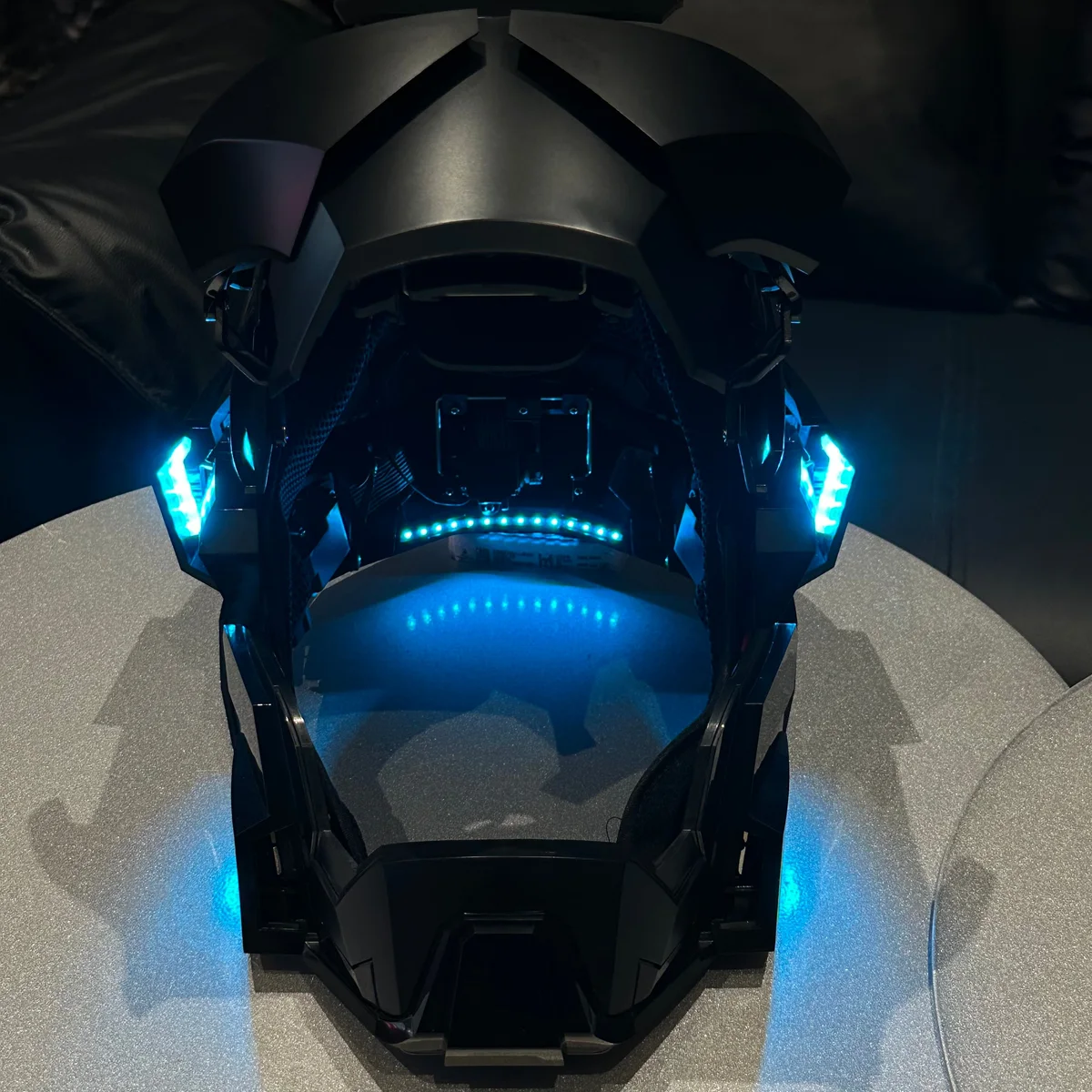 Inside the open Iron Man Mark 17 helmet showing the blue mesh lining and LED strip
