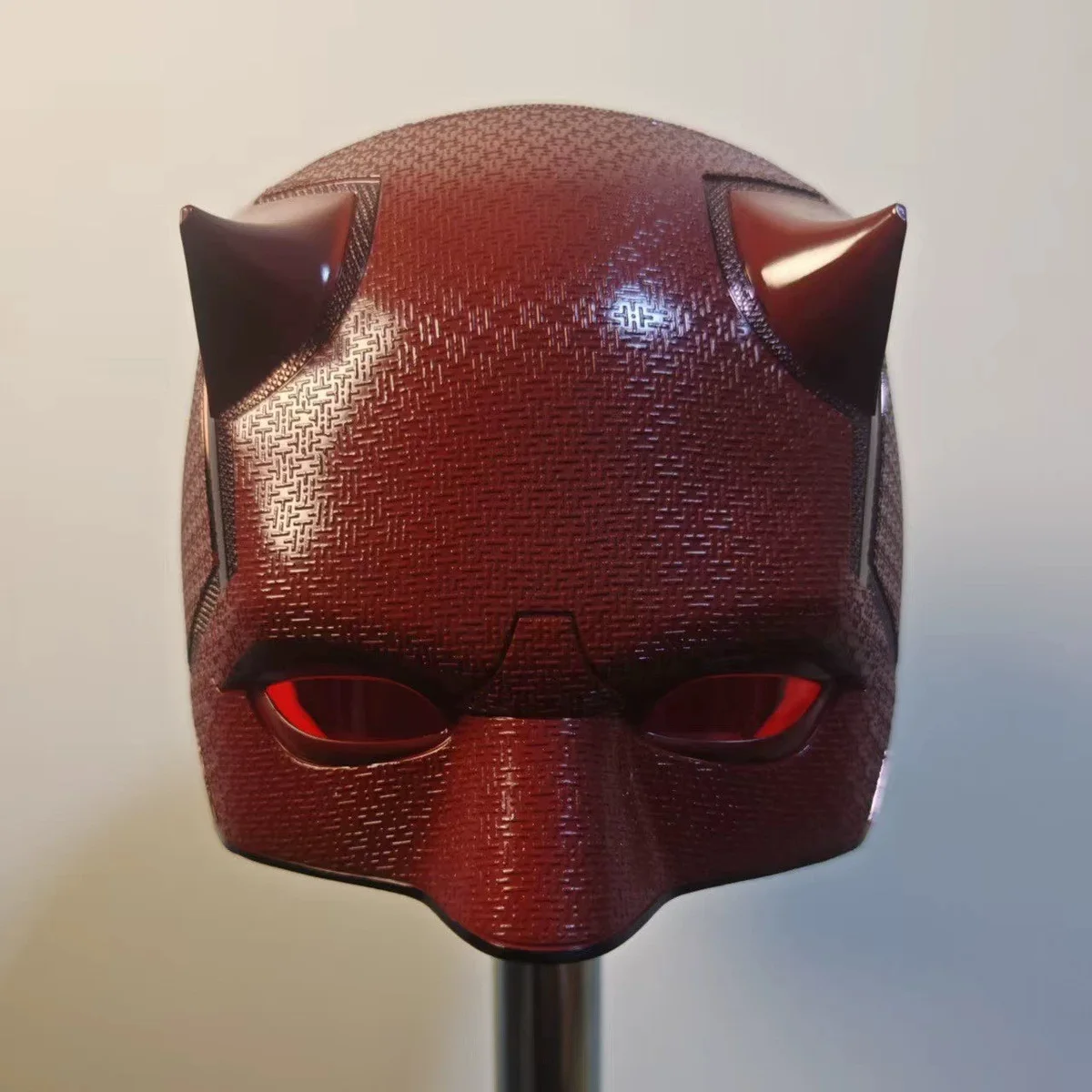 Red Daredevil Born Again mask front view with red lenses