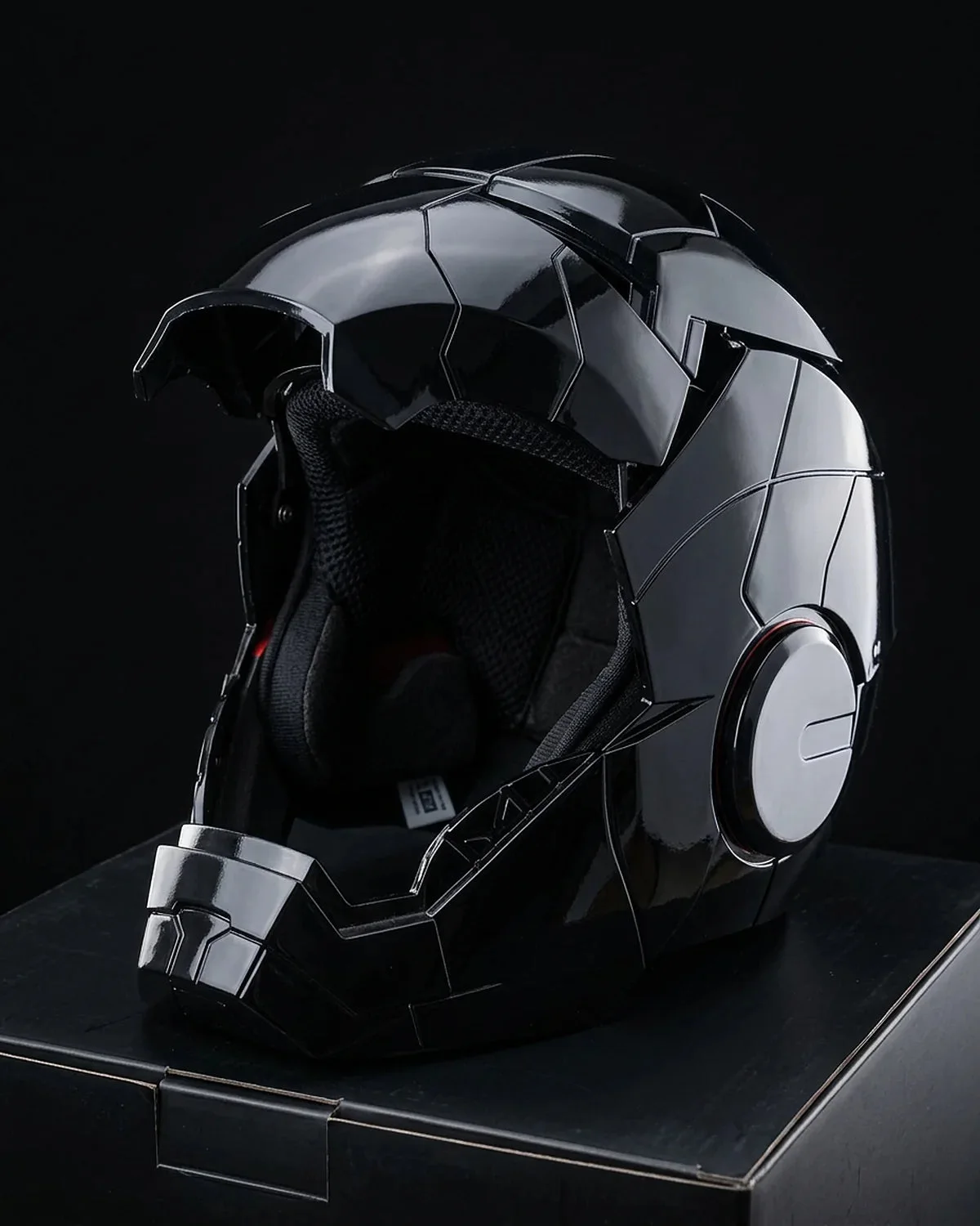 Open black Iron Man MK5 helmet showing the padded mesh lining inside